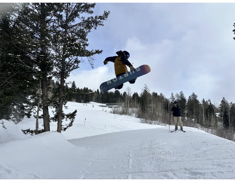 Snowboarding laps after morning CME—resort day for physicians